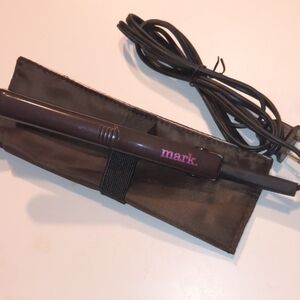 mark. Brown Hair Styling Tool